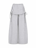 Pants with detachable skirt